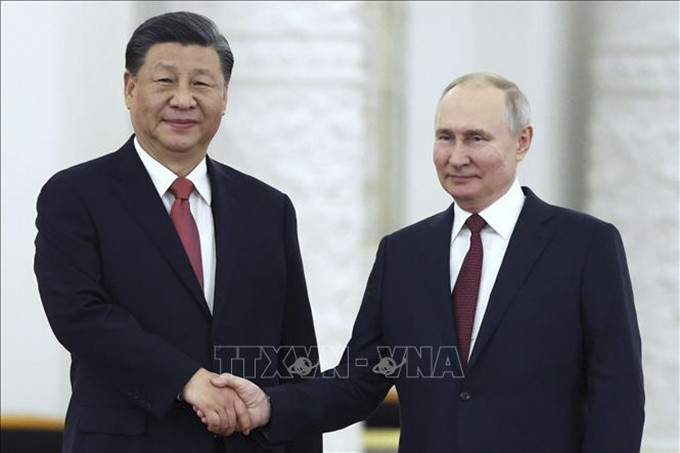 Chủ tịch Trung Quốc Tập Cận Bình (trái) và Tổng thống Nga Vladimir Putin tại Điện Kremlin ở Moskva tối 21/3/2023. Ảnh: AFP/TTXVN